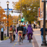 Cars, cars parked, bikers, walkers on the new Hennepin Avenue in Uptown Minneapolis.