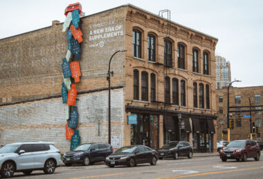 Cymbiotika supplement ad on a building in the North Loop in Downtown Minneapolis.