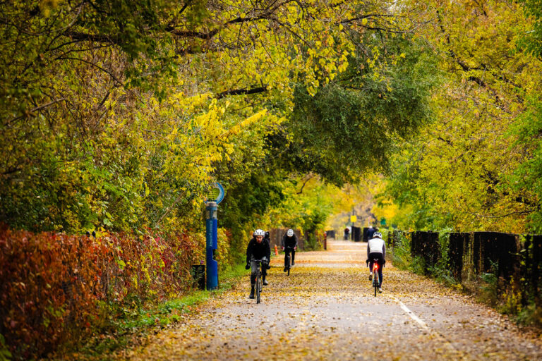 Bikers bike through a colorful Midtown Greenway 3 Beautiful fall colors on the Midtown Greenway in South Minneapolis. This has to be my favorite time of the year!
