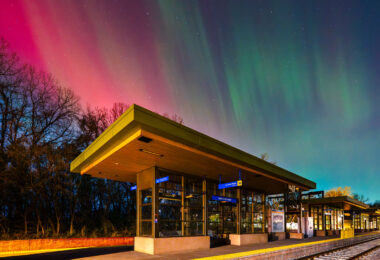 Vivid northern lights over the West 21st Street train station in Minneapolis.