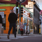 People walking on Lyndale Avenue and Lake Street outside NY Gyro.