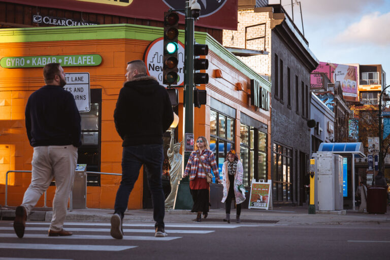 NY Gyro at Lyndale Ave and Lake Street 1 People walking on Lyndale Avenue and Lake Street outside NY Gyro.