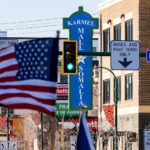 American Flag and Karmel Mall 2 Protester with an American flag outside the Karmel Mall, a Somali shopping center.Thousands marched down Lake Street on a day with windchills struggling to reach 0F.