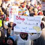 Anti Ice Protest Sign In Minneapolis 1 Protester at a protest against the actions of ICE in Minneapolis holds up a sign that reads "Stop traumatizing our students! Kids can't learn in fear."
The protest took place on a day with near below 0F windchills.
