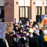 BURN ICE Protest Sign 3 Protester at a protest against the actions of ICE in Minneapolis holds up a sign that reads "BURN ICE".The protest took place on a day with near below 0F windchills.