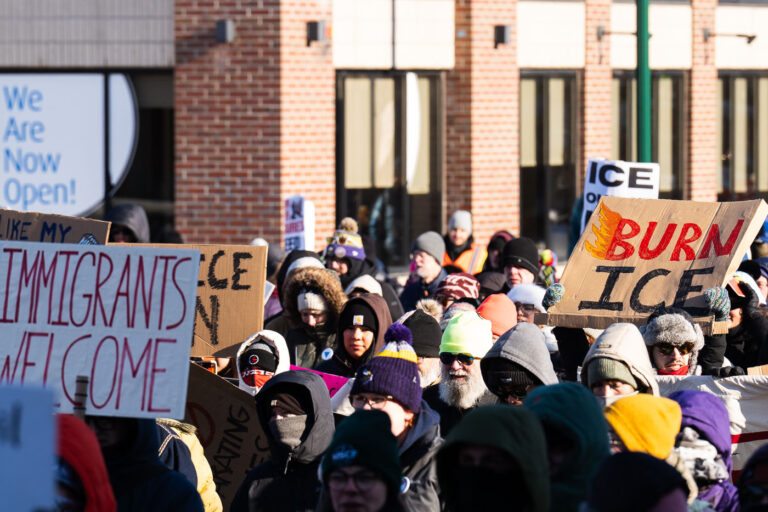 BURN ICE Protest Sign 3 Protester at a protest against the actions of ICE in Minneapolis holds up a sign that reads "BURN ICE".The protest took place on a day with near below 0F windchills.