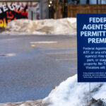 Federal Agents Not Permitted — Winter Notice in Minneapolis 2 A printed yard sign declaring “Federal Agents Not Permitted on Premises” is planted into a snowbank along a city street in late December 2025. The notice explicitly names agencies such as ICE, the DEA, and ATF, asserting that entry requires a valid, recent warrant and framing the space as protected from routine federal enforcement activity.