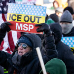 ICE OUT MSP Protest Sign 3 Protester at a protest against the actions of ICE in Minneapolis holds up a sign that reads "Ice Out MSP".The protest took place on a day with near below 0F windchills.