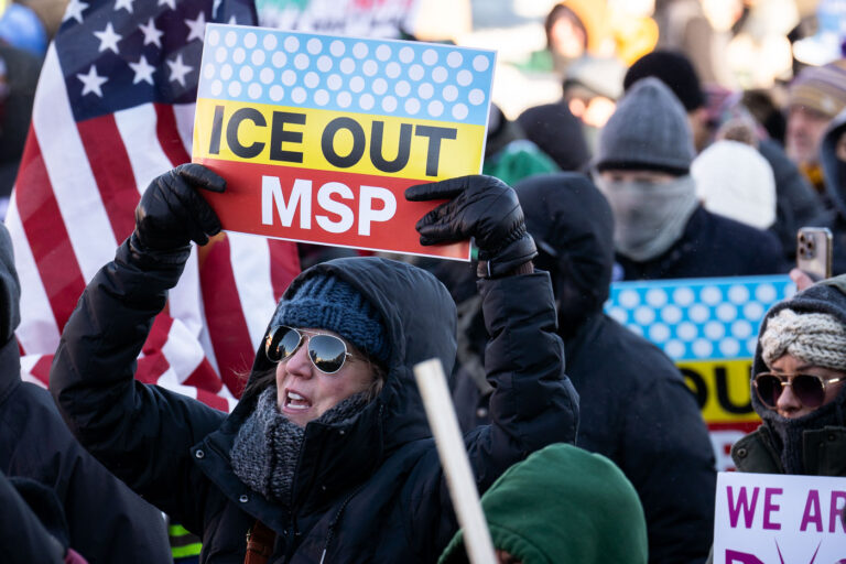 ICE OUT MSP Protest Sign 3 Protester at a protest against the actions of ICE in Minneapolis holds up a sign that reads "Ice Out MSP".The protest took place on a day with near below 0F windchills.