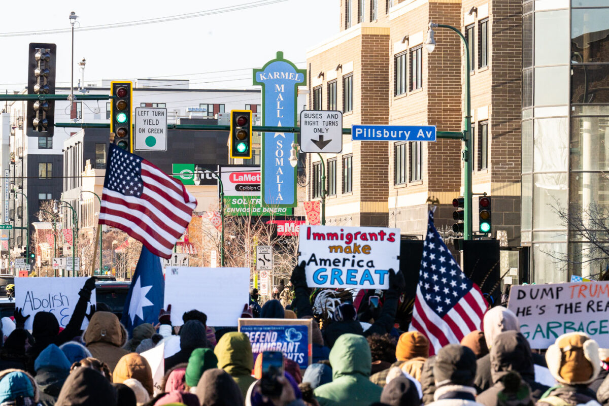 Protesters march to the Karmel Mall, a Somali shopping center in South Minneapolis. Signs reading "Immigrants Make America Great"Thousands marched down Lake Street on a day with windchills struggling to reach 0F.