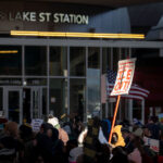 Neighbors Say ICE OUT! 4 Protesters march down Lake Street past the Lake St Station.The protest took place on a day with near below 0F windchills.