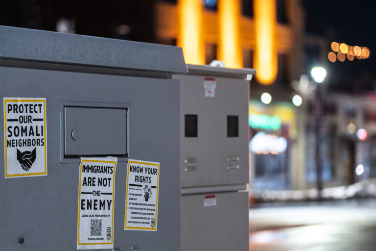 Protect Our Somali Neighbors in Minneapolis 3 Posters on electrical boxes in Uptown Minneapolis that reads "Protect our Somali Neighbors".