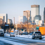 Snow covered Nicollet Ave and Minneapolis Skyline 2 Snow covered Nicollet Ave and the Minneapolis Skyline. The Minneapolis police 5th precinct police station on the right.
