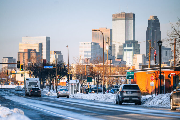 Snow covered Nicollet Ave and Minneapolis Skyline 2 Snow covered Nicollet Ave and the Minneapolis Skyline. The Minneapolis police 5th precinct police station on the right.