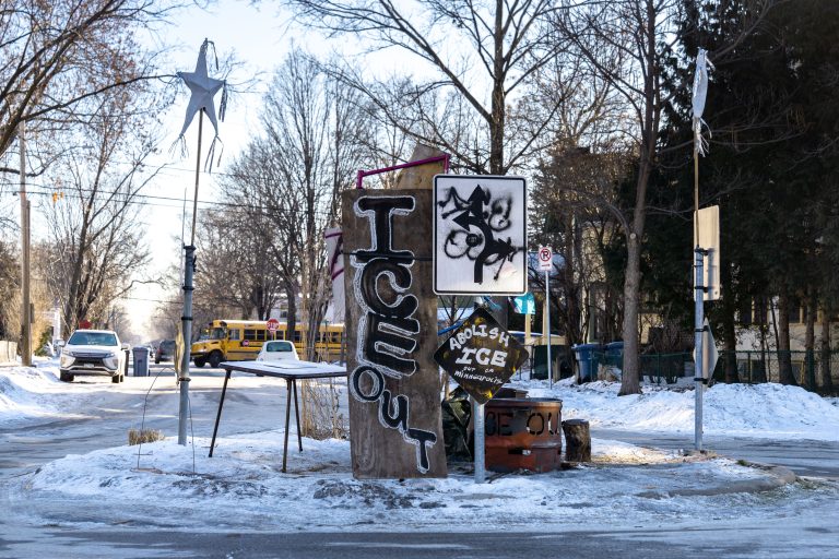 Minneapolis Roundabout Protest: Abolish ICE Signs 1 Protest signs in a Minneapolis roundabout on January 29, 2026, call to "Abolish ICE" and "ICE OUT."