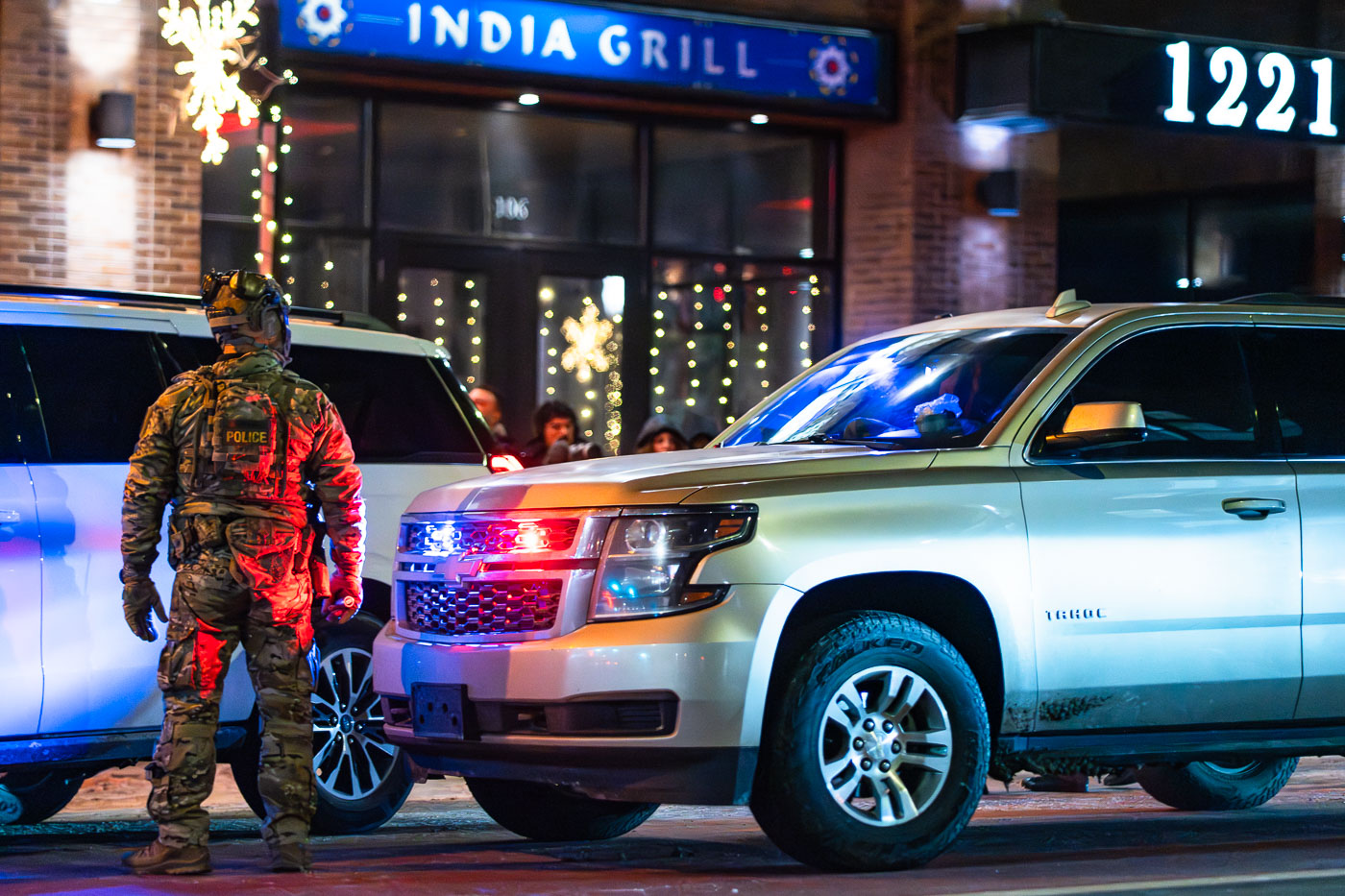 Armed BORTAC officer stands on Lake Street, Minneapolis