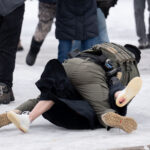 Border Patrol arrests a protester, Minneapolis 2 A protester is arrested outside the Whipple Federal Building outside Minneapolis.Protests have gathered outside the fenced in building as hundreds of agents stand outside the fence.