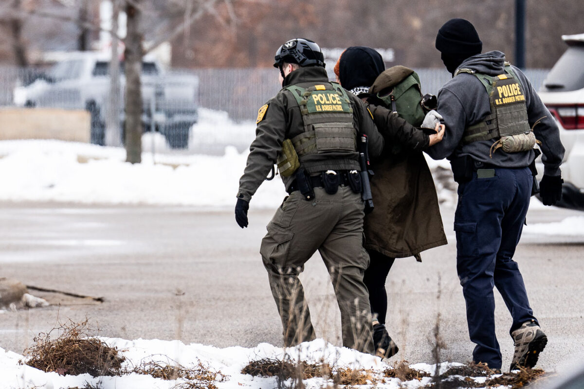 Border Patrol officers take away a protester at the Whipple federal detention center just outside of Minneapolis on January 8th, 2026.