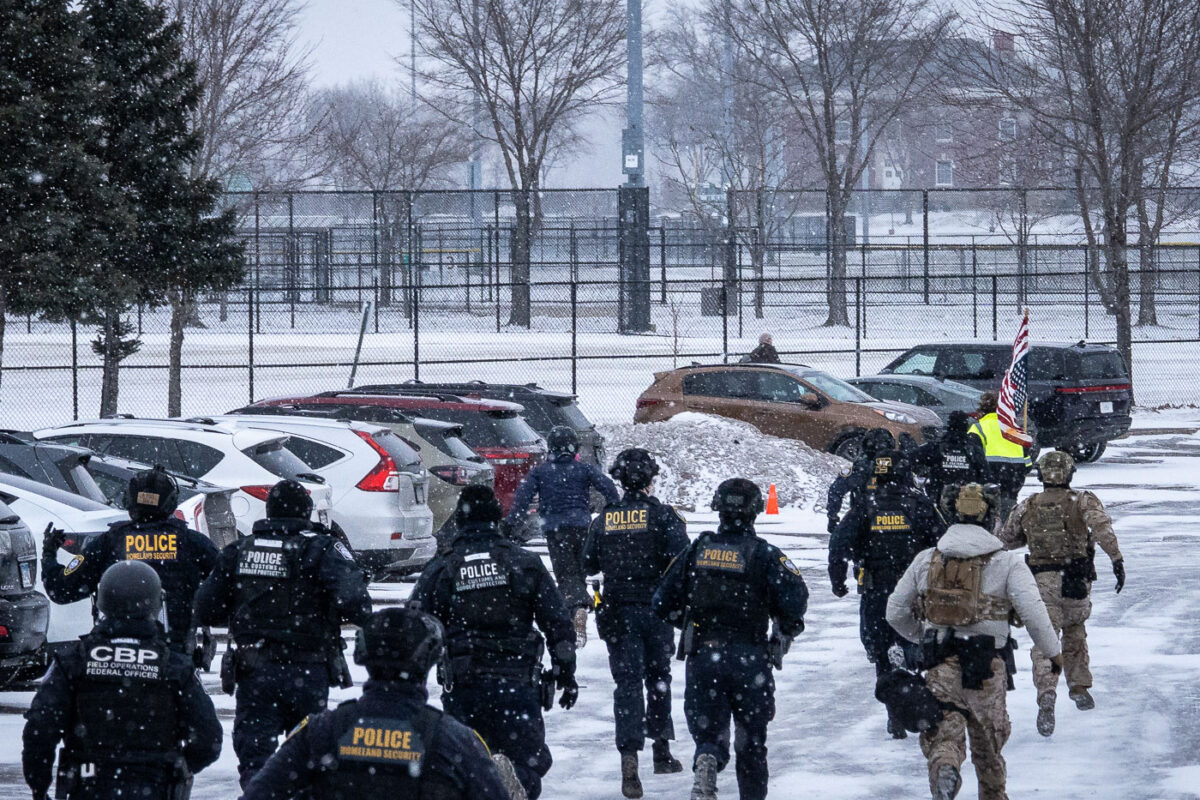 Border Patrol and Homeland Security police chase and arrest protester William Kelly at the Whipple federal building in Minneapolis on January 16, 2026.