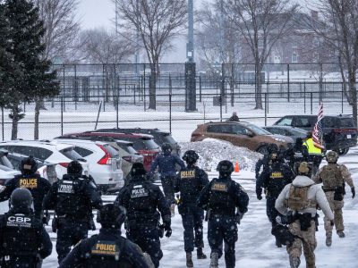 Border Patrol and DHS chase protester at Whipple Building, Minneapolis