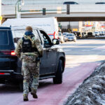 BORTAC Officer on Lake Street, Minneapolis 2 BORTAC officer runs back to a vehicle on Lake Street in Minneapolis on January 14, 2026.
