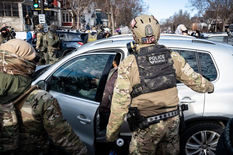BORTAC Police and a women in her car, Minneapolis 3 Federal agents ram a man's vehicle and demand identification at Park Avenue and 35th Street in Minneapolis on January 12, 2026. The Latino man says he was let go once they realized he was a US citizen. While doing so, a crowd as well as more officers continued to arrive before releasing tear gas and pepper spraying members of the media and their cameras.Park and 35th Street is 2 blocks away from where ICE agents shot and killed Renee Good on January 7, 2026.