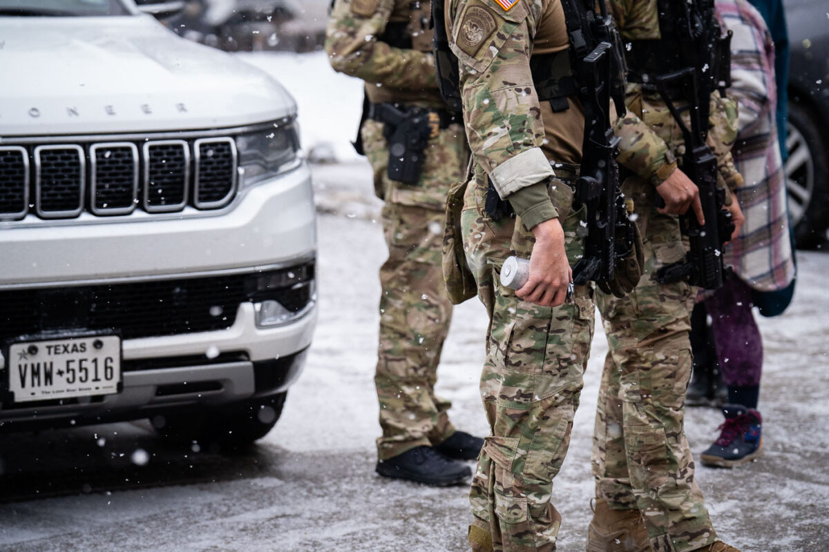 Members of the Border Patrol tactical team, BORTAC, hold cans of tear gas in Minneapolis on January 21, 2026.