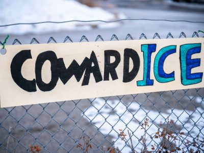 "CowardICE" Sign on a Fence Outside the Whipple Building