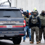 Defend The Homeland SUV in Minneapolis 4 A US Government SUV with "Defend The Homeland" "Integrity, Courage, Endurance" written on it as seen in Minneapolis on January 8, 2026.