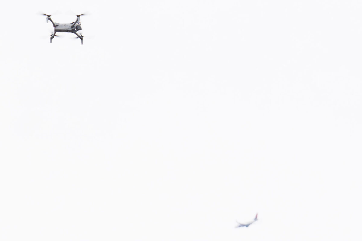 A DJI Mini 3 being flown by a federal agent at the Whipple building outside Minneapolis.