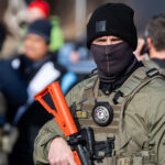 Federal Agent with Less Lethal Weapon at Park Ave 2 Federal agents ram a man's vehicle and demand identification at Park Avenue and 35th Street in Minneapolis on January 12, 2026. The Latino man says he was let go once they realized he was a US citizen. While doing so, a crowd as well as more officers continued to arrive before releasing tear gas and pepper spraying members of the media and their cameras.Park and 35th Street is 2 blocks away from where ICE agents shot and killed Renee Good on January 7, 2026.
