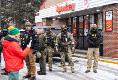 Federal agents outside a Speedway gas station in South Minneapolis as an observer blows a whistle. Seen on January 21, 2026.