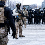 Federal agents in riot gear at Whipple, January 16 2026 2 Federal agents in riot gear outside the Whipple building near Minneapolis on January 16, 2026.