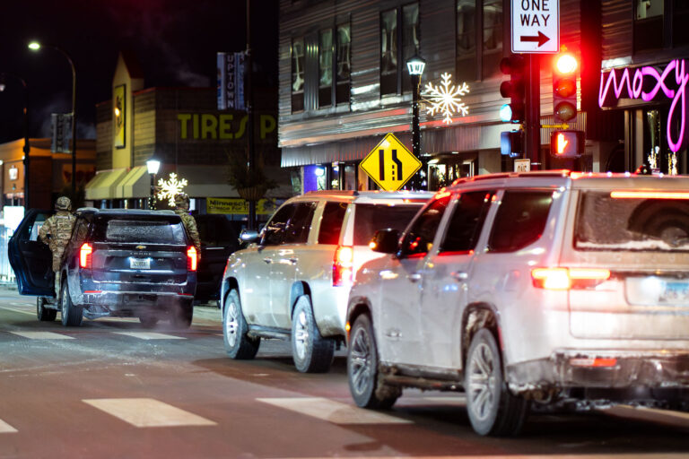 Federal Agents Standing in SUV Doors, Minneapolis 3 An SUV driving down Hennepin Avenue with 2 federal agents standing in the doors in Uptown Minneapolis on January 19, 2026.