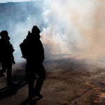 Federal Agents Toss Tear Gas at Protesters, Minneapolis 3 ICE and Border Patrol agents on Nicollet Avenue on January 24, 2026. This follows the shooting death of Minneapolis resident Alex Pretti. Pretti is the second person killed and third person shot by federal agents in Minneapolis this month.