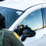 Federal Officers on Lake Street, Minneapolis 1 Federal US Border Patrol officers in vehicles on Lake Street in Minneapolis.
