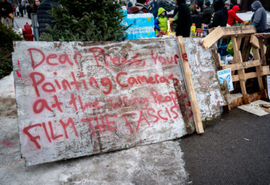 Street barricades on Portland Avenue where the Renee Good Memorial is.