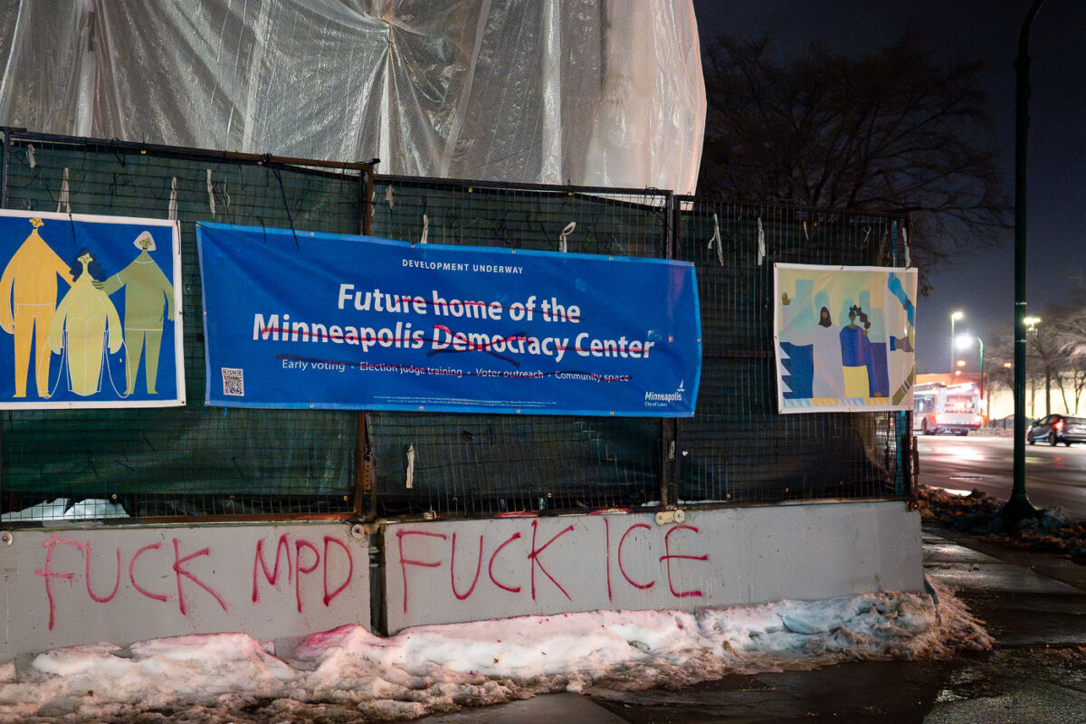 Graffiti on the barricades around the former Minneapolis police 3rd precinct police station. The police station was burned in May 2020 following the murder of George Floyd.