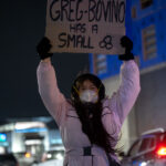 Greg Bovino has a small, Minneapolis protest sign 4 Drums to semi horns, protesters showed up outside a suburban Minneapolis hotel they believe federal officers including Greg Bovino are staying at. Outnumbered by the press at times, a few protesters were arrested after given dispersal orders.