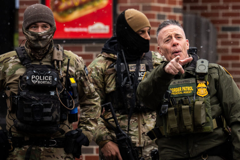 Greg Bovino Points at Observer in Minneapolis 4 Greg Bovino points at an observer in Minneapolis as he stands with the Border Patrol BORTAC unit outside a South Minneapolis gas station on January 21, 2026.