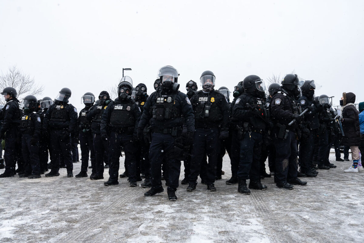 Homeland Security Police in riot gear outside the Whipple building near Minneapolis on January 16, 2026.