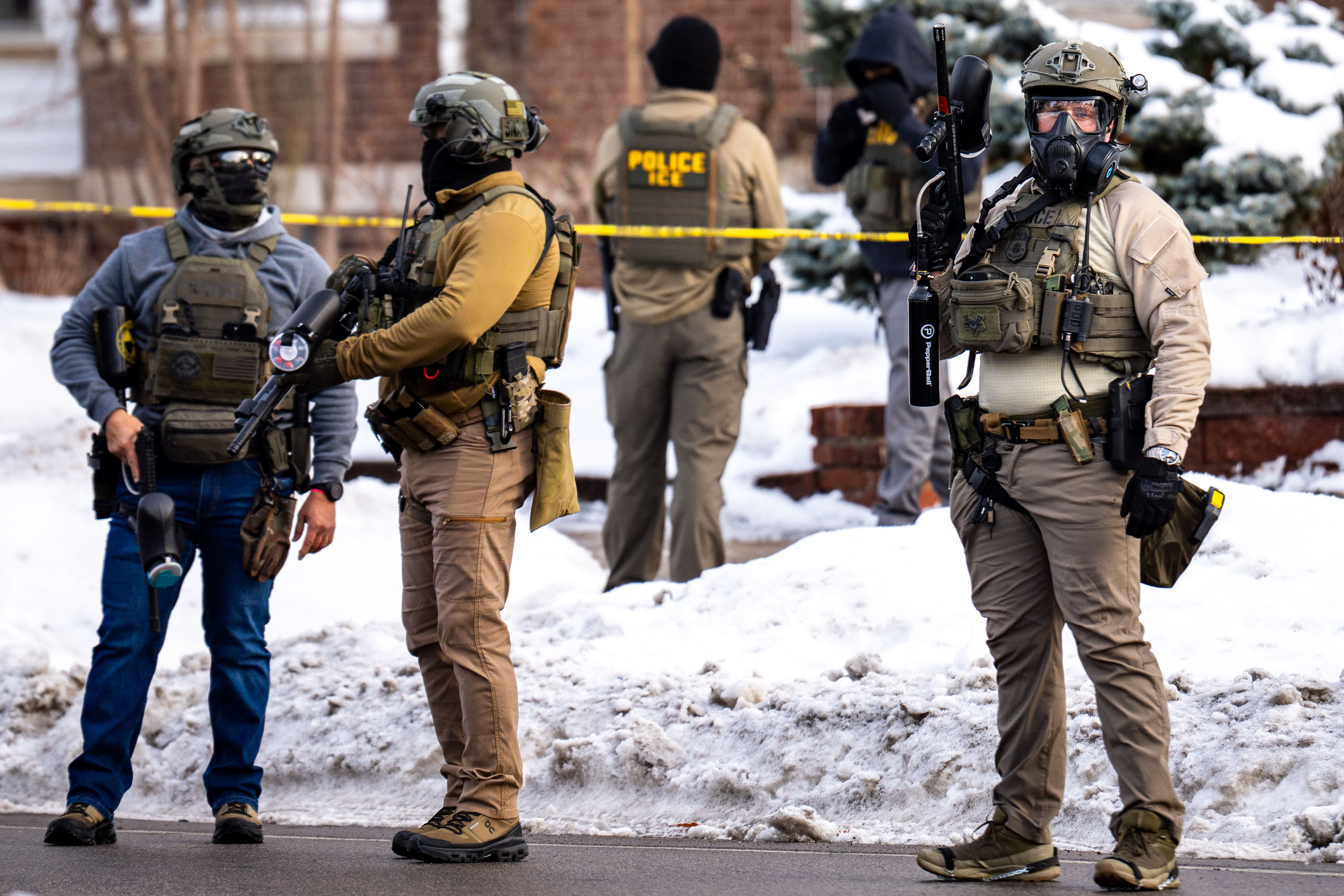 Armed ICE agents stand on Portland Avenue in South Minneapolis after Renee Good killing