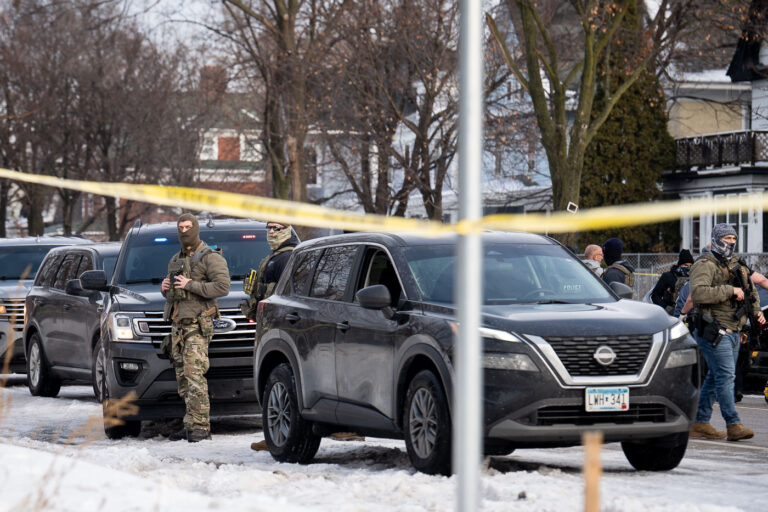 ICE Agents guard the Renee Good crime scene 3 Portland Avenue and 34th Street in South Minneapolis where City of Minneapolis officials have confirmed an ICE agent shot an observer.
A neighbor who saw what happened told local MPR news: "She was trying to turn around, and the ICE agent was in front of her car, and he pulled out a gun and put it right in — like, his midriff was on her bumper — and he reached across the hood of the car and shot her in the face like three, four times,”