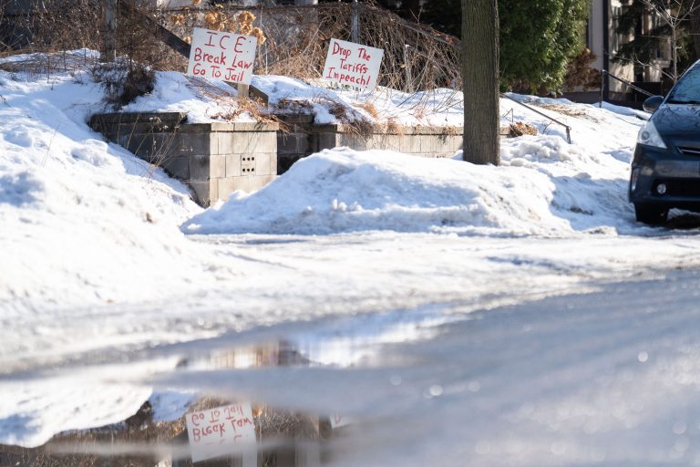 Minneapolis Yard Signs Protest ICE and Tariffs 1 Yard signs in Minneapolis protest ICE and tariffs in the snow.