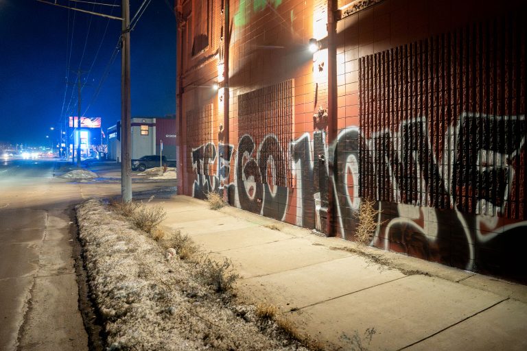 Minneapolis Graffiti: ICE Go Home, Operation Metro Surge 1 Graffiti reading "ICE GO HOME" on a building in Minneapolis during Operation Metro Surge.