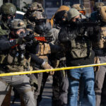 Officers with less lethal launchers, Minneapolis 4 ICE and Border Patrol agents on Nicollet Avenue on January 24, 2026. This follows the shooting death of Minneapolis resident Alex Pretti. Pretti is the second person killed and third person shot by federal agents in Minneapolis this month.
