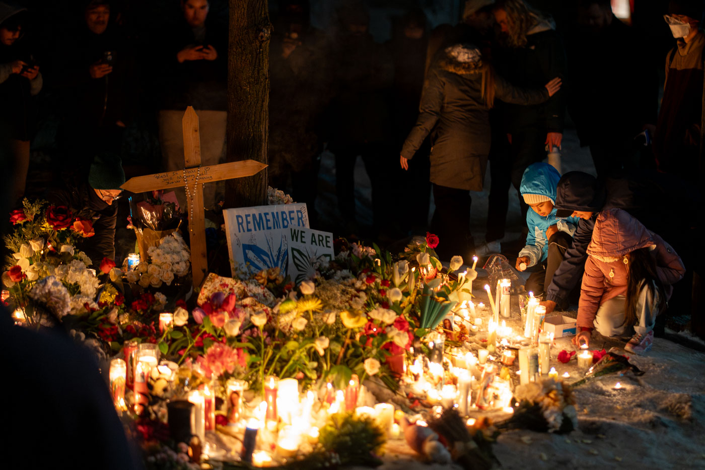 Lighting Candles at Renee Good Memorial