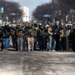 Line of federal agents in Minneapolis 1 ICE and Border Patrol agents on Nicollet Avenue on January 24, 2026. This follows the shooting death of Minneapolis resident Alex Pretti. Pretti is the second person killed and third person shot by federal agents in Minneapolis this month.