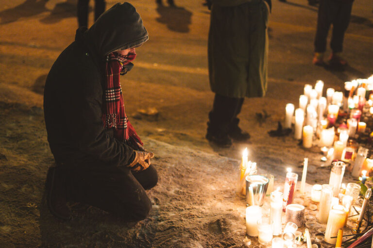 Man kneels at Alex Pretti Memorial, Minneapolis 3 At the memorial of Alex Pretti who was shot and killed by Border Patrol officers arlier in the day in Minneapolis on January 25, 2026.