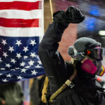 Maple Gove Noise Demo Anti ICE 3 Drums to semi horns, protesters showed up outside a suburban Minneapolis hotel they believe federal officers including Greg Bovino are staying at. Outnumbered by the press at times, a few protesters were arrested after given dispersal orders.